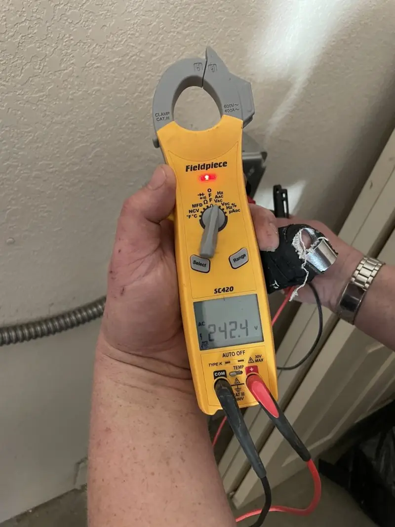 Voltage testing with clamp meter during Circuit Breaker Repair in Lake Villa